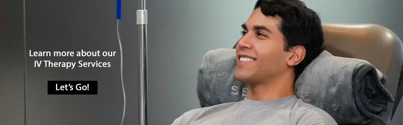 Guy relaxing and receiving IV therapy in spa chair